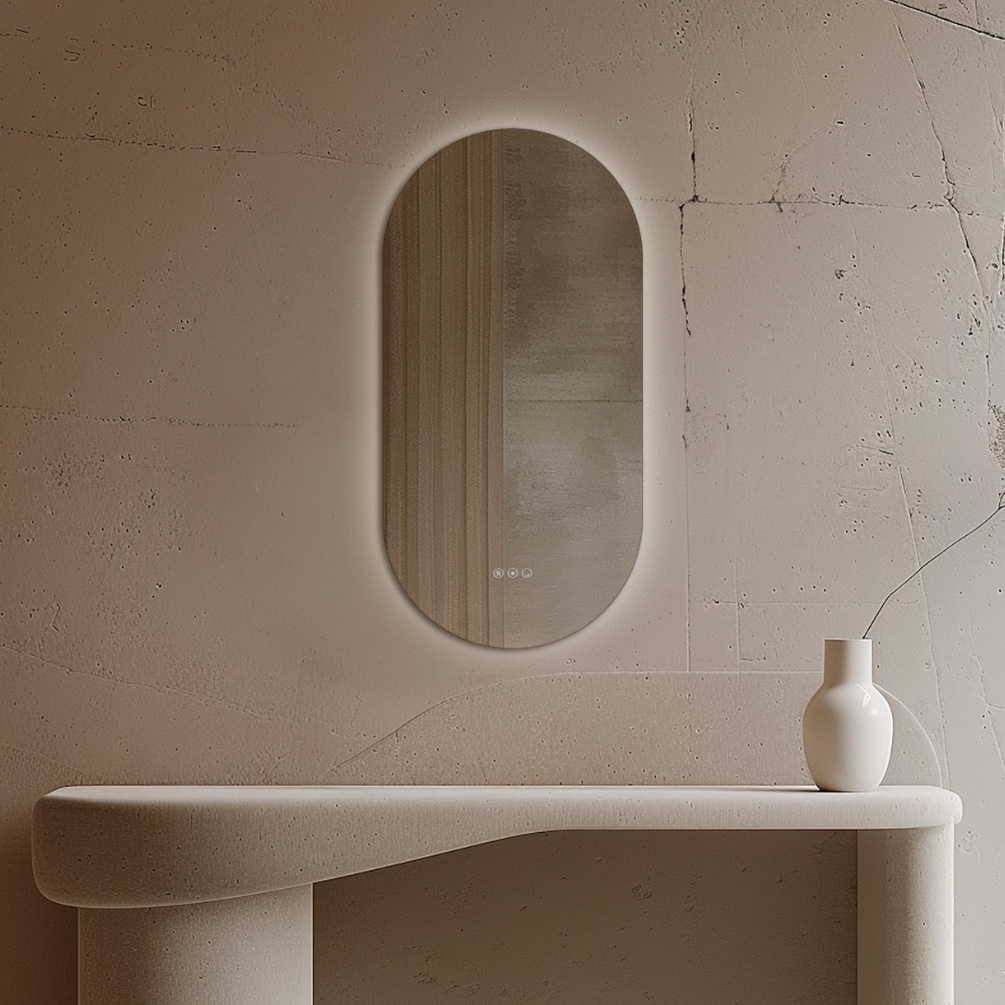 Product Lifestyle Photo of Origins Living Claris 450mm x 900mm Capsule Bathroom Mirror hanging on a wall in front of a table.
